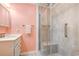 Bathroom with tiled shower, glass door, and white vanity at 415 Ocean Creek Dr. # 2373, Myrtle Beach, SC 29572