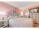 A bedroom with light wood furniture and coral walls at 415 Ocean Creek Dr. # 2373, Myrtle Beach, SC 29572