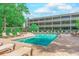 Inviting community pool surrounded by lush landscaping at 415 Ocean Creek Dr. # 2373, Myrtle Beach, SC 29572