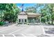 Gated entrance to a community with guardhouse and American flag at 415 Ocean Creek Dr. # 2373, Myrtle Beach, SC 29572