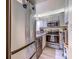 Modern kitchen with stainless steel appliances, white cabinets, and light wood-look flooring at 415 Ocean Creek Dr. # 2373, Myrtle Beach, SC 29572