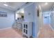 Breakfast bar, hallway, and kitchen with light blue walls and white cabinets at 415 Ocean Creek Dr. # 2373, Myrtle Beach, SC 29572