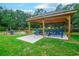 Outdoor picnic area with covered pavilion and blue picnic tables at 415 Ocean Creek Dr. # 2373, Myrtle Beach, SC 29572