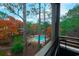 Pool view with trees and lounge chairs, seen from the balcony at 415 Ocean Creek Dr. # 2373, Myrtle Beach, SC 29572