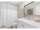 Modern bathroom with a white vanity, shower, and tasteful decor at 4445 Kingsport Rd. # 303, Little River, SC 29566