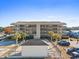 Exterior view of the condo building with parking and landscaping at 4445 Kingsport Rd. # 303, Little River, SC 29566