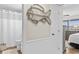 Hallway leading to the bathroom and bedroom, adorned with a decorative fish at 4445 Kingsport Rd. # 303, Little River, SC 29566