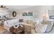 Living room with comfortable sectional sofa and coastal decor at 4445 Kingsport Rd. # 303, Little River, SC 29566