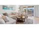 Living room with plush seating, sliding glass doors, and balcony access at 4445 Kingsport Rd. # 303, Little River, SC 29566