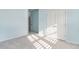 Empty, light blue bedroom with carpet flooring and white closet doors at 509 Covewood Ct., Longs, SC 29568