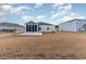 Back exterior of home with a sunroom addition at 509 Covewood Ct., Longs, SC 29568