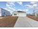 Inviting single-story home with a two-car garage and landscaped front yard at 509 Covewood Ct., Longs, SC 29568