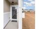 Covered front porch with a glass front door and a welcome mat at 509 Covewood Ct., Longs, SC 29568