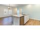 Well-appointed kitchen with a large island, stainless steel appliances, and plenty of counter space at 509 Covewood Ct., Longs, SC 29568