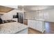 Modern kitchen featuring white shaker cabinets, granite countertops, and stainless steel appliances at 509 Covewood Ct., Longs, SC 29568