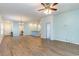 Open-concept living area with wood-look flooring, a ceiling fan, and recessed lighting at 509 Covewood Ct., Longs, SC 29568
