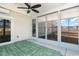 Bright sunroom with ceiling fan and green outdoor rug at 509 Covewood Ct., Longs, SC 29568