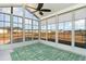 Sunroom with vaulted ceiling, ceiling fan, and views of the backyard at 509 Covewood Ct., Longs, SC 29568