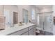 Elegant bathroom with double vanity, modern fixtures, and a glass-enclosed shower at 527 Firouz Dr, Longs, SC 29568