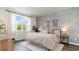 Relaxing bedroom with large windows, stylish decor, and a comfortable bed at 527 Firouz Dr, Longs, SC 29568