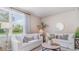 Cozy living area with comfortable white sofas, stylish decor, and ample natural light at 527 Firouz Dr, Longs, SC 29568