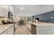 Modern open kitchen with white cabinets, granite countertops, and stainless steel appliances at 547 Slaty Dr., Myrtle Beach, SC 29588