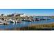 Picturesque marina with boats docked and a waterfront restaurant in the background at 547 Slaty Dr., Myrtle Beach, SC 29588