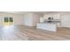 Open-concept living area with wood-look flooring and a view of the backyard at 620 Grateful Dr., Little River, SC 29566