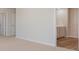 Primary bedroom with ensuite bath access and neutral carpeting at 620 Grateful Dr., Little River, SC 29566