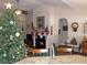 Living room with Christmas tree, fireplace, and view into the kitchen at 741 Londonberry Ct., Conway, SC 29526