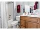 Clean and bright bathroom with a bathtub/shower combo and wood vanity at 785 Rambler Ct., Myrtle Beach, SC 29579