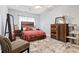 Cozy bedroom featuring a wooden bedframe, matching furniture, and soft rug at 785 Rambler Ct., Myrtle Beach, SC 29579