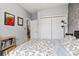 Bedroom with a floral bedspread, white closet, and geometric accent wall at 785 Rambler Ct., Myrtle Beach, SC 29579