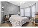 Spacious bedroom with decorative geometric accent wall and ample windows at 785 Rambler Ct., Myrtle Beach, SC 29579