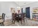 Dining area with a square table, seating for four, and a bookshelf at 785 Rambler Ct., Myrtle Beach, SC 29579