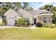 Charming single-story home with a two-car garage and landscaped front yard at 785 Rambler Ct., Myrtle Beach, SC 29579