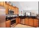 Well-equipped kitchen with stainless steel appliances, ample counter space, and wood cabinetry at 785 Rambler Ct., Myrtle Beach, SC 29579