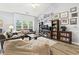 Spacious living room with high ceilings, built-in bookcase, and ample natural light at 785 Rambler Ct., Myrtle Beach, SC 29579