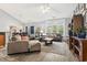Inviting living room with comfortable seating, large windows, and stylish decor at 785 Rambler Ct., Myrtle Beach, SC 29579