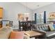 Open concept dining and living area with a gray sectional sofa at 785 Rambler Ct., Myrtle Beach, SC 29579