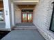 Covered entryway with wood double doors and brick walls at 826 Waterton Ave., Myrtle Beach, SC 29579