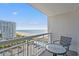 Relaxing balcony with seating and views of the ocean, beach, and pool at 9820 Queensway Blvd. # 903, Myrtle Beach, SC 29572