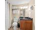 Well-maintained bathroom with dark granite countertop, wood vanity, and tiled floor at 9820 Queensway Blvd. # 903, Myrtle Beach, SC 29572