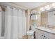 Clean bathroom with granite countertop, white cabinetry, and tiled floor at 9820 Queensway Blvd. # 903, Myrtle Beach, SC 29572