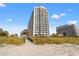 Wooden walkway leading to the beach with dunes and high-rise buildings at 9820 Queensway Blvd. # 903, Myrtle Beach, SC 29572