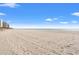 Expansive sandy beach next to high-rise buildings at 9820 Queensway Blvd. # 903, Myrtle Beach, SC 29572