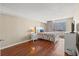 Cozy bedroom with hardwood floors, white furniture, and sliding glass door to a balcony at 9820 Queensway Blvd. # 903, Myrtle Beach, SC 29572
