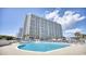 Large community pool next to high-rise building at 9820 Queensway Blvd. # 903, Myrtle Beach, SC 29572
