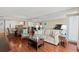 Open concept living and dining area with wooden floors and coastal decor at 9820 Queensway Blvd. # 903, Myrtle Beach, SC 29572