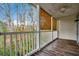 Outdoor balcony overlooking a lush wooded area at 1286 River Oaks Dr. # 8-M, Myrtle Beach, SC 29579